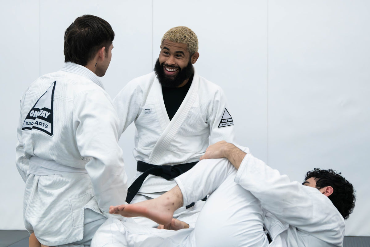 Black belt coach teaching a Brazilian Jiu-Jitsu class at One Way Martial Arts in Alexandria, VA