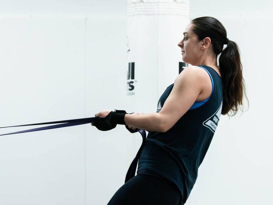 Athlete doing resistance band rows in Strength and Conditioning at One Way Martial Arts, Alexandria VA