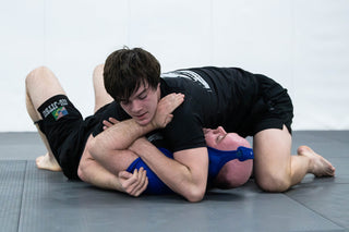No-Gi BJJ training partners working a submission at One Way Martial Arts in Alexandria, VA