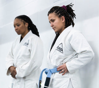 Two women in gis during BJJ class at One Way Martial Arts in Alexandria, VA