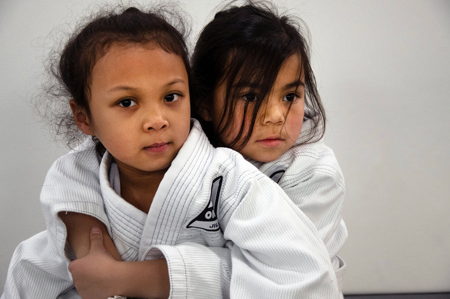 Two young children in BJJ gis at One Way Martial Arts Kids BJJ in Alexandria, VA