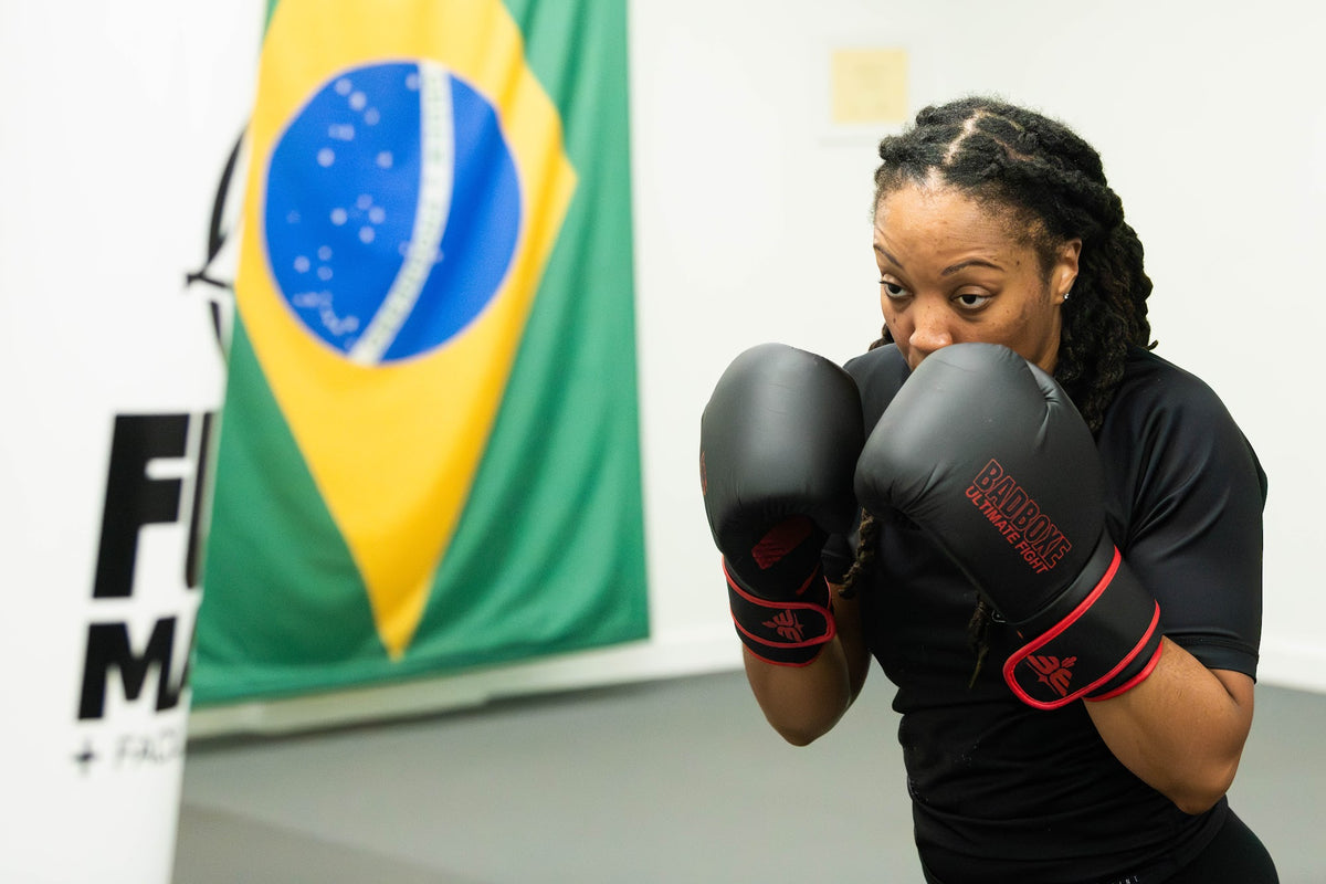 Boxing student in guard stance with gloves at One Way Martial Arts in Alexandria, VA
