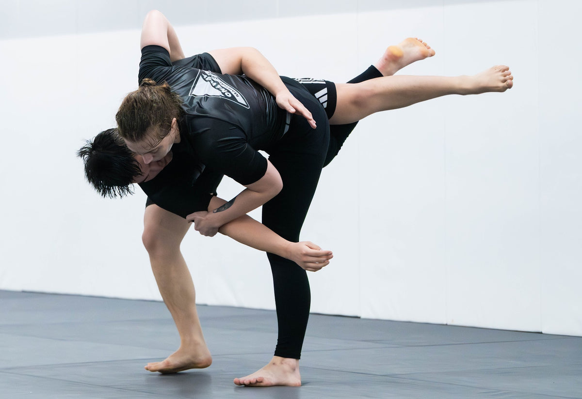 Students drilling a kick catch in Muay Thai class at One Way Martial Arts in Alexandria, VA