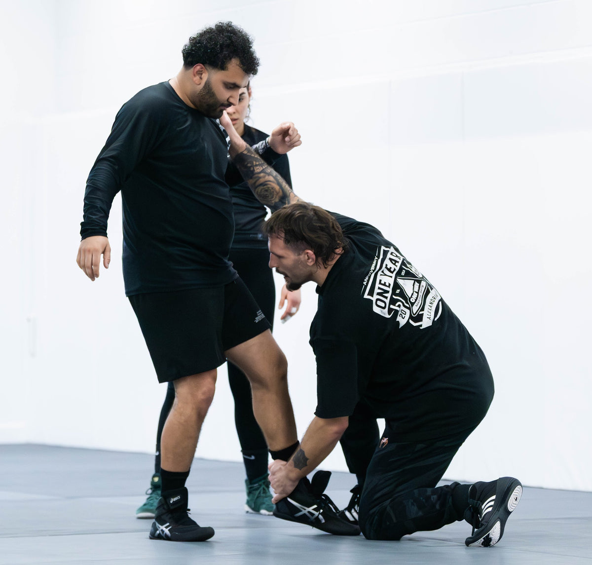 Coach demonstrating a No-Gi technique at One Way Martial Arts in Alexandria, VA