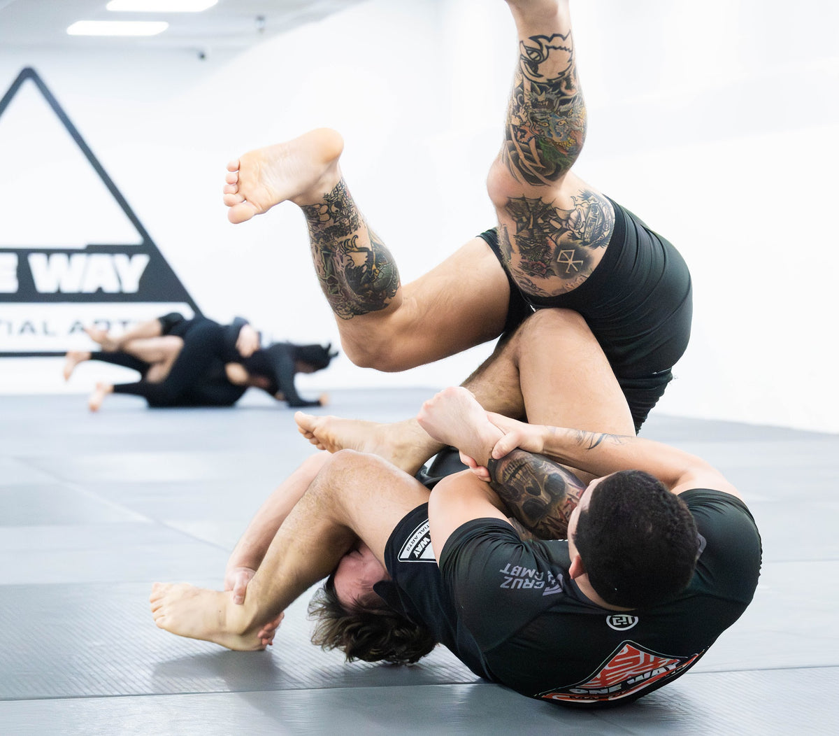 Grapplers working leg entanglements in No-Gi class at One Way Martial Arts in Alexandria, VA