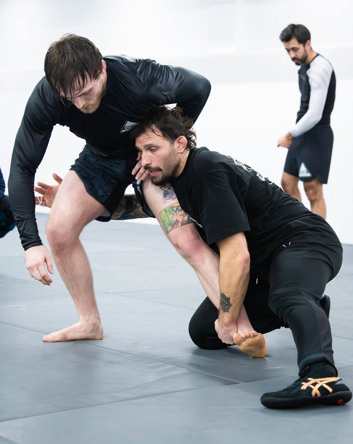 Grappler shooting a takedown in No-Gi class at One Way Martial Arts in Alexandria, VA