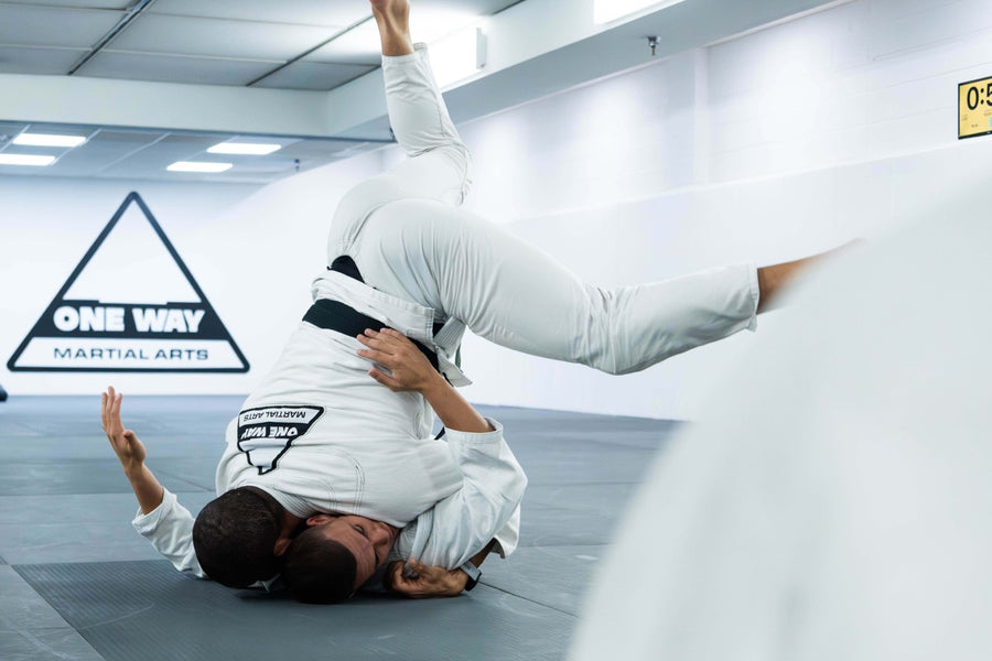 BJJ throw during a Gi class at One Way Martial Arts in Alexandria, VA