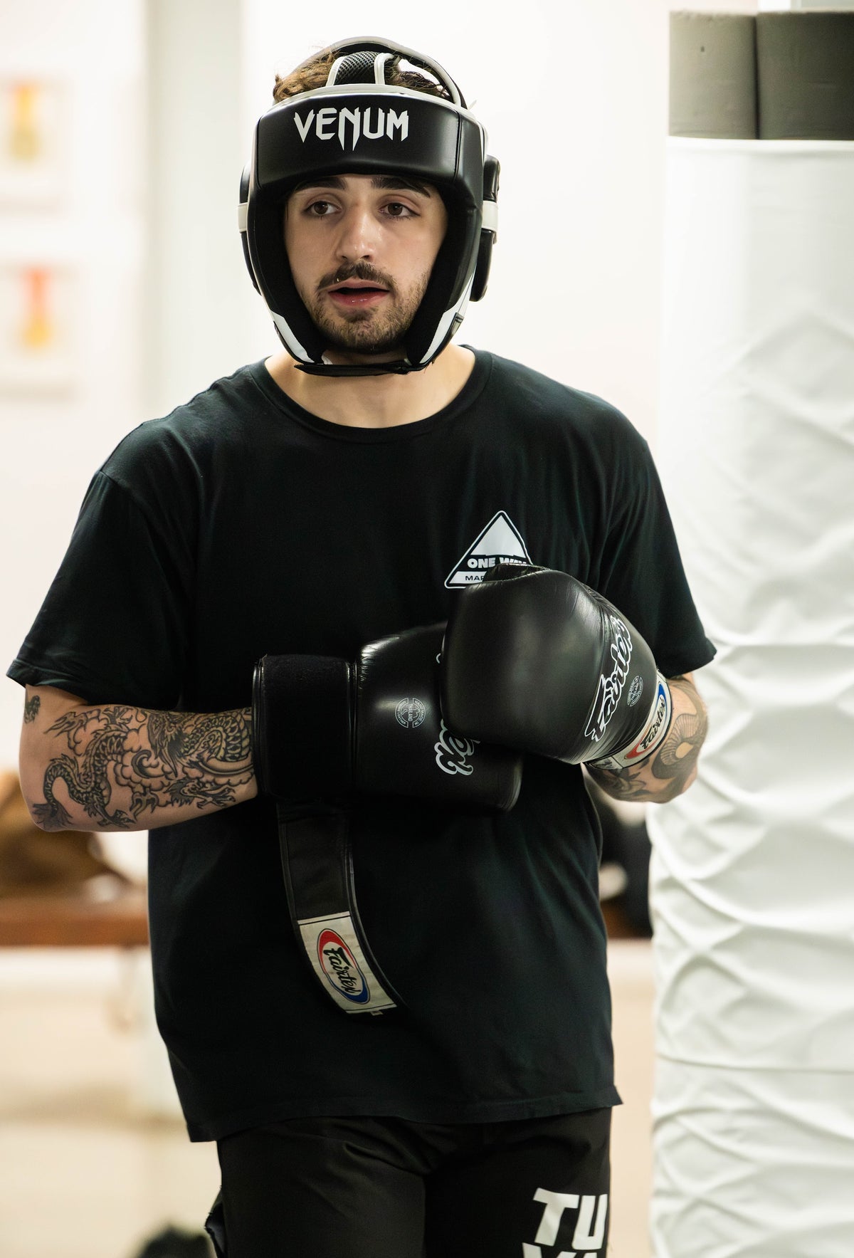 Striking student in headgear ready for sparring at One Way Martial Arts in Alexandria, VA